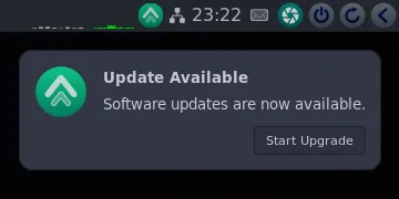 GhostBSD corner panel showing software update notification icon