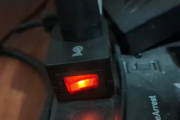 $3 on/off power outlet switch used to disconnect network equipment and improve office security